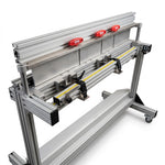 Roofify DRÄCO K1-AGNU-4 segmented metal folding machine with adjustable depth stop and red handles on a mobile stand.
