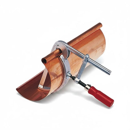 Roofify MASC gutter clamping tool securing a copper gutter section for professional soldering and riveting work.